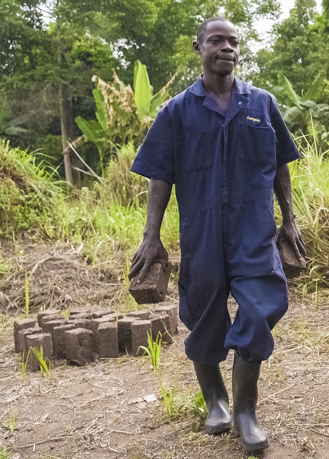 Ivan Ssembajwe 2 Ivan carrying mulch