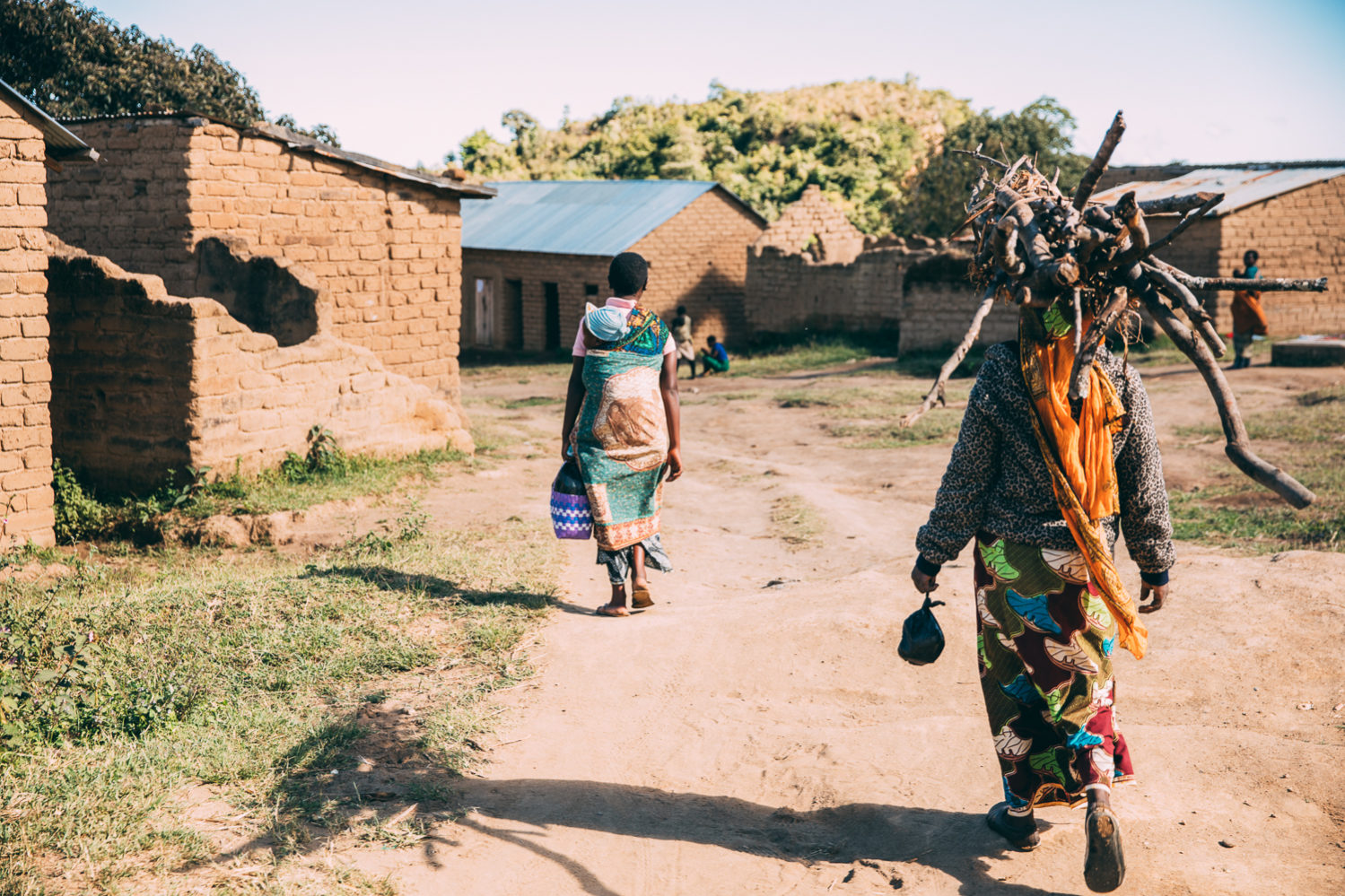 women fetching firewood in Tanzania